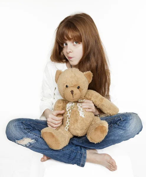 Red-haired teen girl and teddy bear — Stock Photo, Image