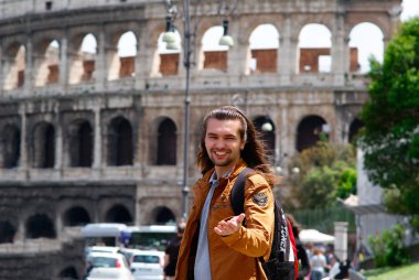 Young guy Colosseum Rome, Italy clipart
