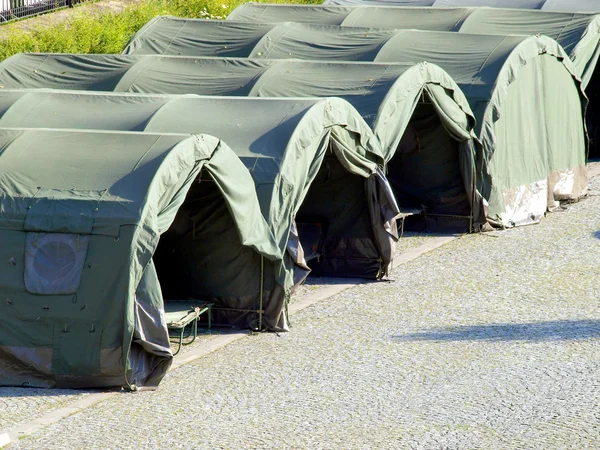 Several large military tents on the paved area — Stock Photo, Image