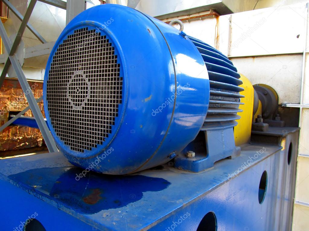 large electric motor of blue color as the drive to the fan