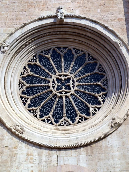 Cathedral of Trento, round window with ornate stained glass rose — Stock Photo, Image