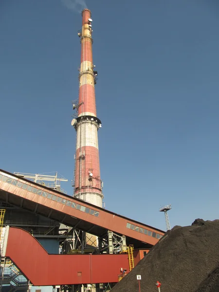 A tall chimney with smoke visible — Stock Photo, Image