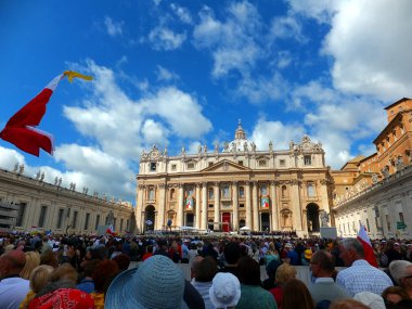 ROME, VATICAN - April 28, 2014: polish pilgrims listen to the ma clipart