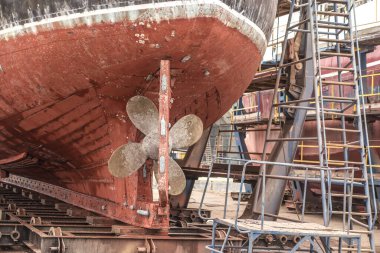 The hull and propeller of a fishing boat during renovation in the port of Wladyslawowo in Poland.