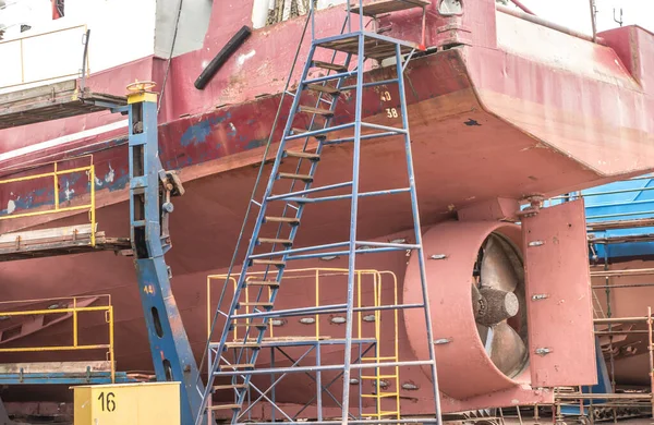 The hull and propeller of a fishing boat during renovation in the port of Wladyslawowo in Poland.