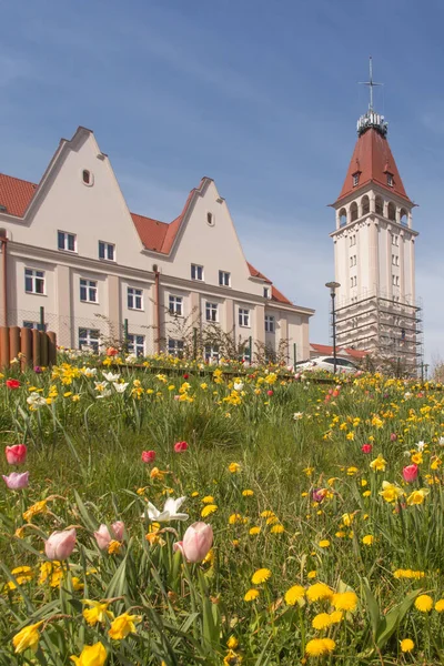 Fisherman\'s House (Dom Rybaka) in Wladyslawowo - a public building in Wladyslawowo, built in the 1950s.  Flower meadow in front of the building.