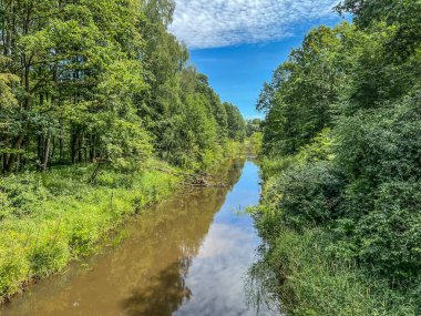 Old, ruined locks that used to stop the water of the Mala Panew River in its upper course. Poland