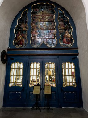 Gdansk, Poland, May 15, 2022: Interior of St. Mary's Basilica in Gdansk, Poland. Decorative door with a stained glass window.