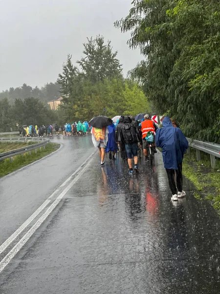 Walking pilgrimage to Our Lady of Jasna Gora in Czestochowa in rainy weather. Poland