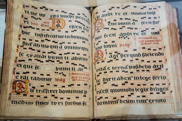 Zarnowiec, Poland, May 13, 2022: Church of the Annunciation of the Lord and the Benedictine Abbey in Zarnowiec in the Diocese of Gdansk. Fragment of old liturgical books, decorated, with musical notation.