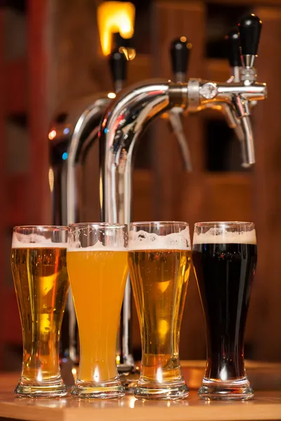 Four glasses of beer — Stock Photo, Image