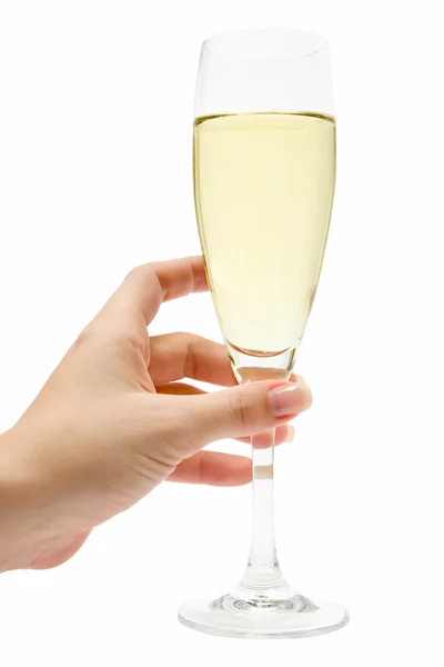 Trzyma kieliszek z szampanem — Zdjęcie stockowe
