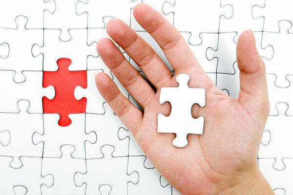 Holding a Jigsaw Piece