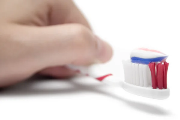 Sostener un cepillo de dientes — Foto de Stock