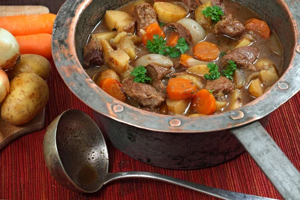 Irish stew in old copper pot — Stock Photo, Image