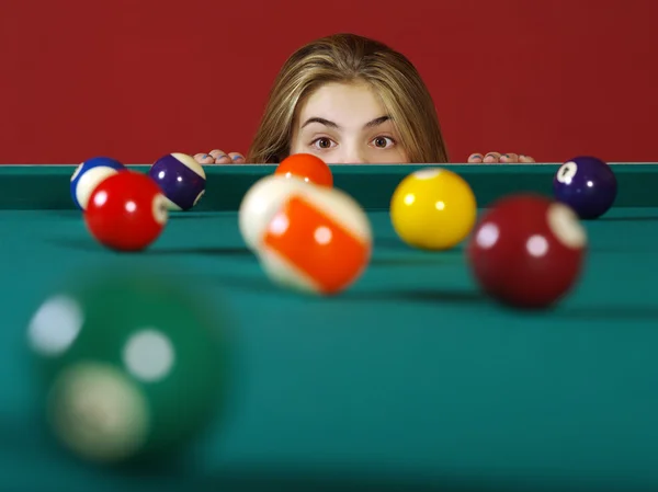 Checking for a shot while playing pool — Stock Photo, Image