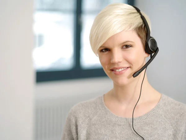 Attractive receptionist with headset — Stock Photo, Image
