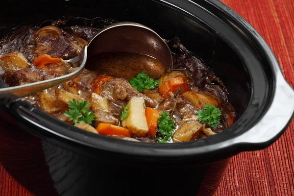 Irish stew in a slow cooker pot — Stock Photo, Image