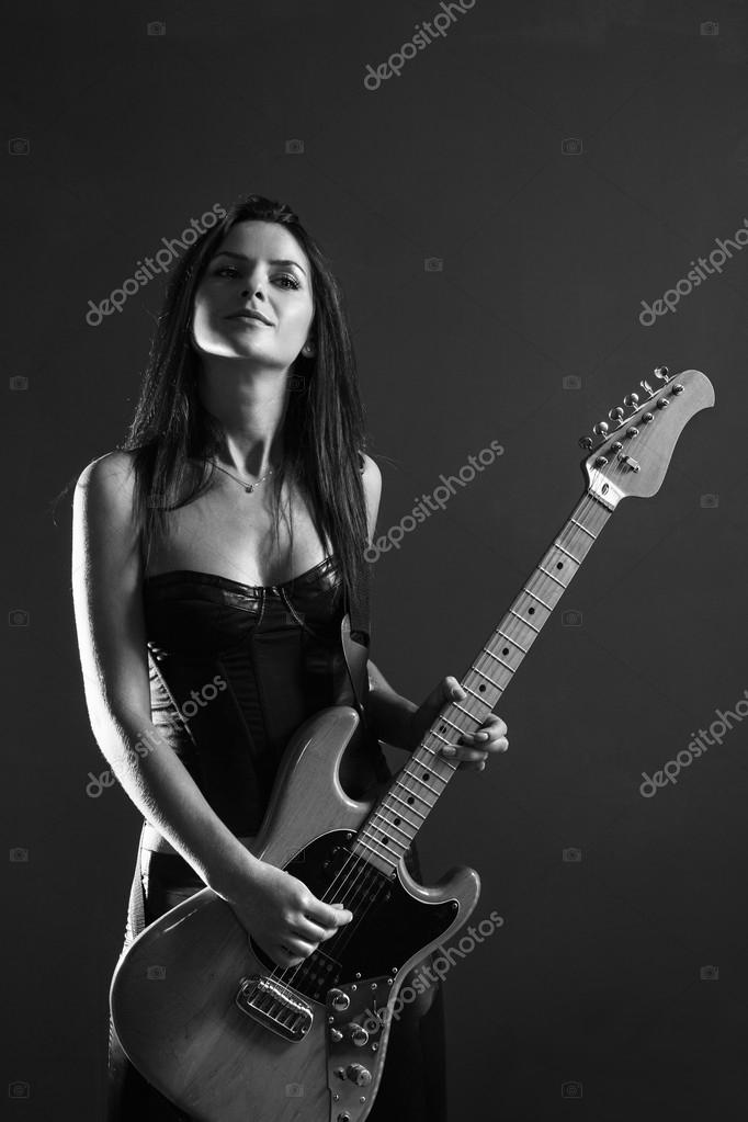Beautiful female guitar player black and white — Stock Photo © sumners
