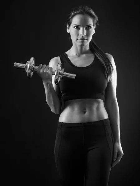 Beautiful woman doing dumbbell curl — Stock Photo, Image