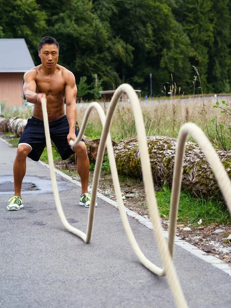 Outdoor fitness with training ropes — Stock Photo, Image