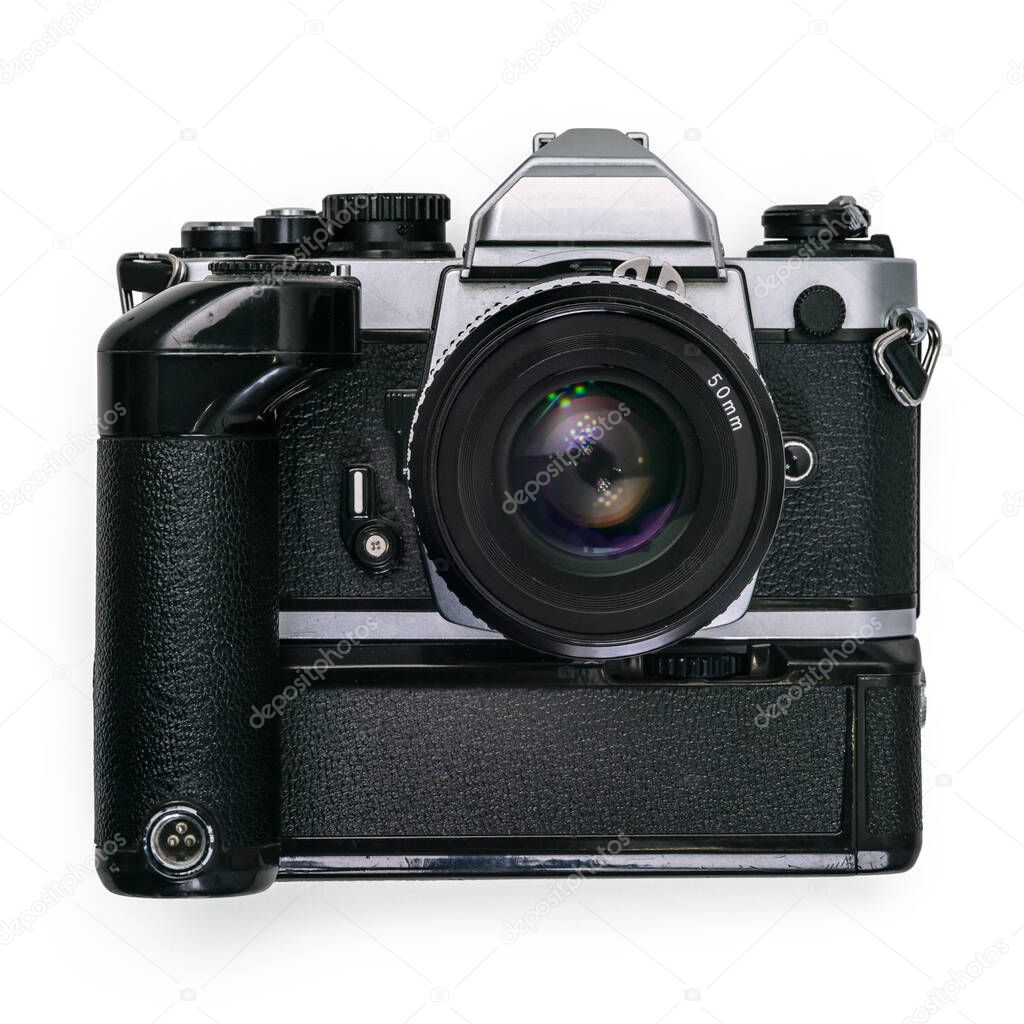 Antique 35mm SLR film camera with motor drive isolated on white background.