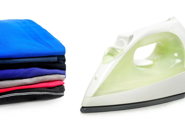 Isolated flat iron and clothes — Stock Photo, Image