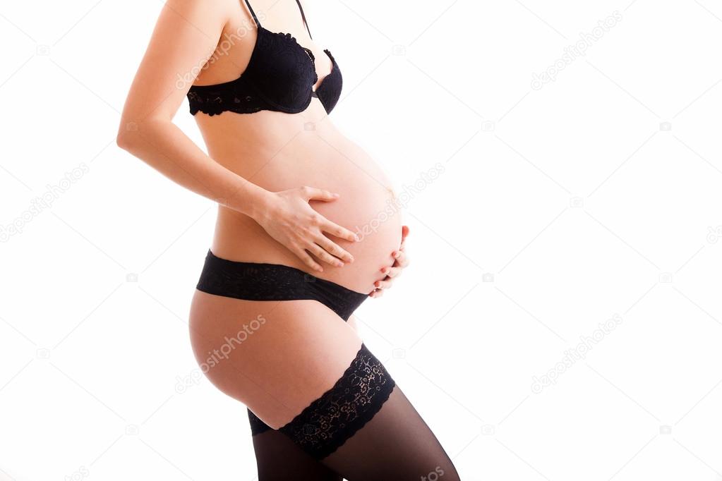 Pregnant woman wearing lingerie
