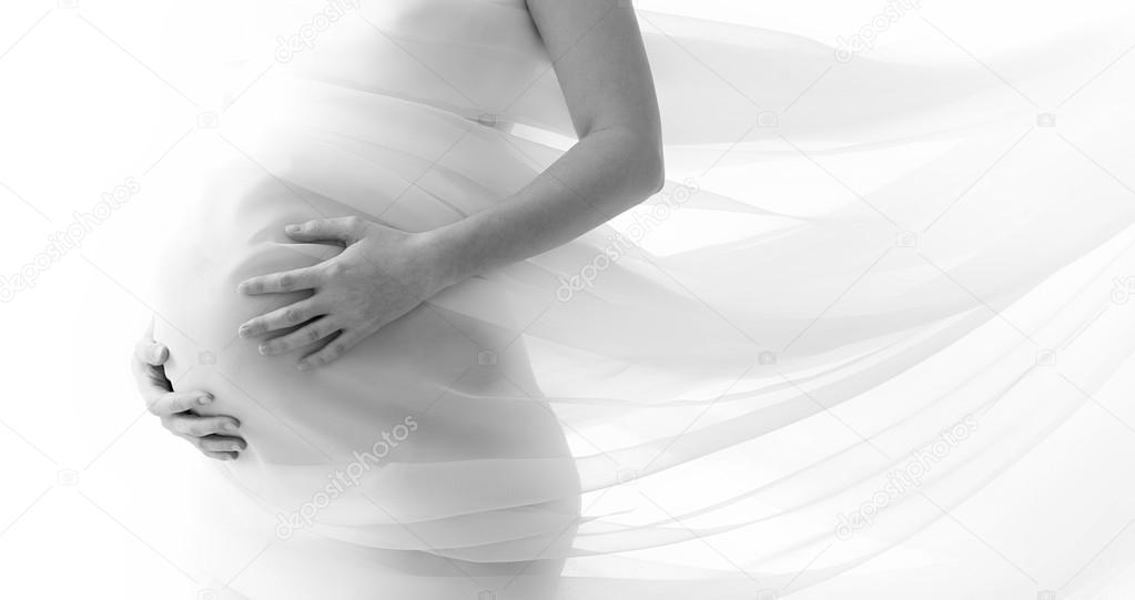 Pregnant woman wrapped in veil