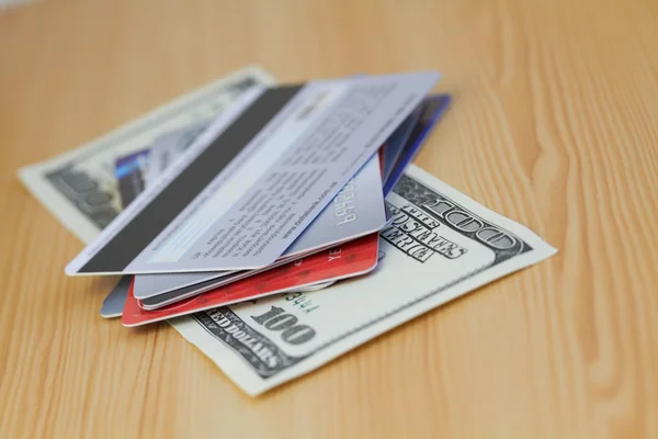 Credit card and 100 dollar close-up — Stock Photo, Image