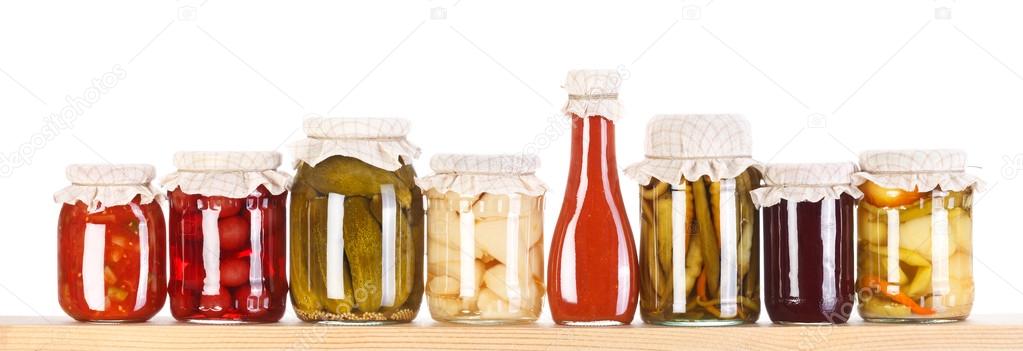Various preserves on a wooden shelf — Stock Image Various preserves on a wooden shelf Royalty Free Stock Photos