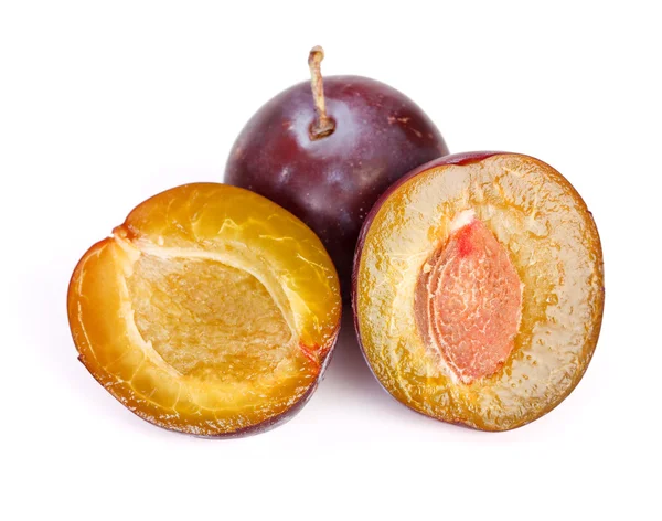 Whole and half plums — Stock Photo, Image