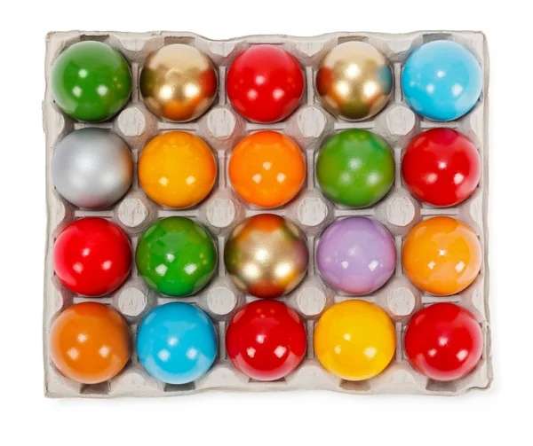 Colorful painted Easter eggs in cardboard storage rack — Stock Photo, Image