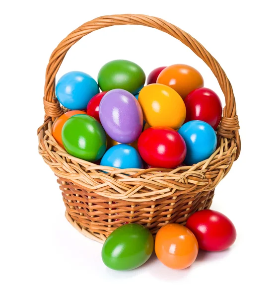 Easter eggs in wicker basket — Stock Photo, Image