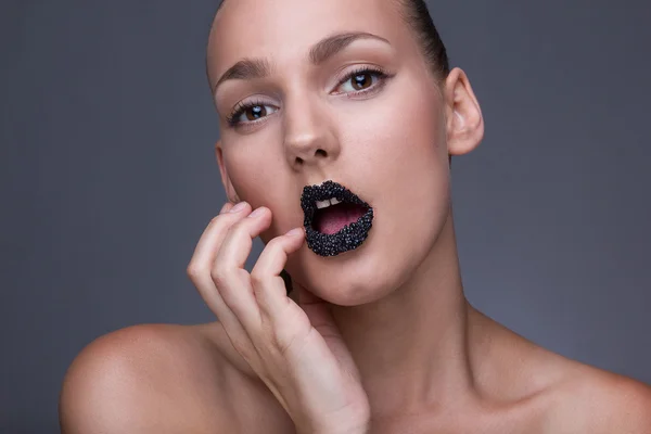Model with black caviare lips — Stock Photo, Image