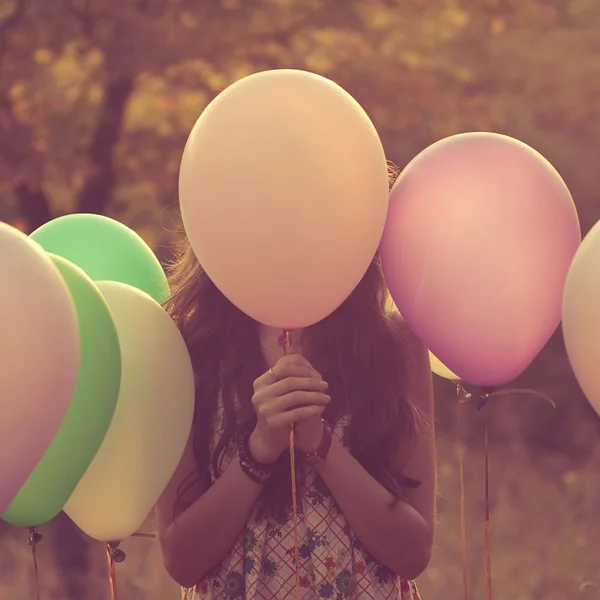 Girl and balloons — Stock Photo, Image