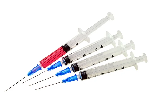 Four medical syringes — Stock Photo, Image