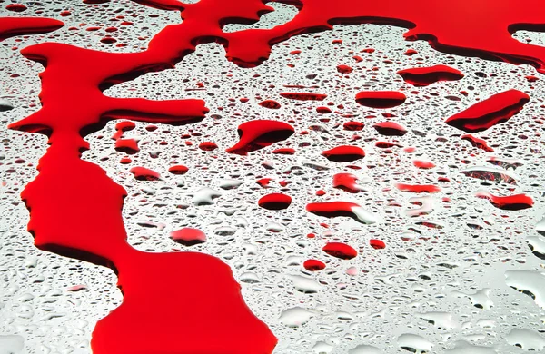Gotas de agua y fondo sanguíneo — Foto de Stock