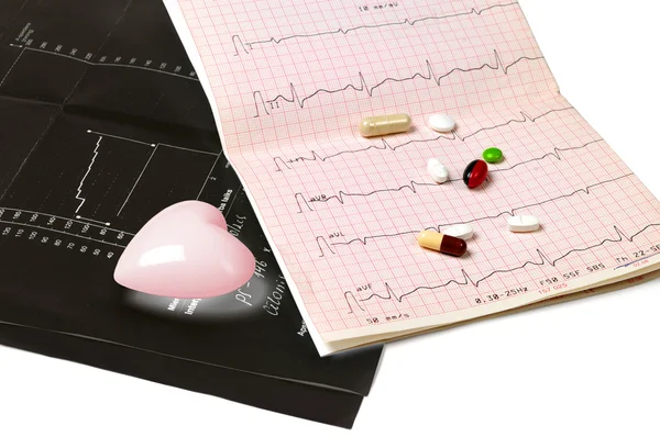 Black electrocardiogram and tablets — Stock Photo, Image