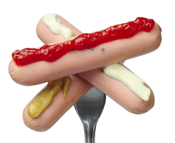 Three sausages on a fork — Stock Photo, Image