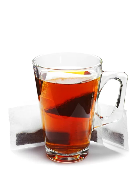 Tazza di tè di vetro e bustine di tè — Foto Stock