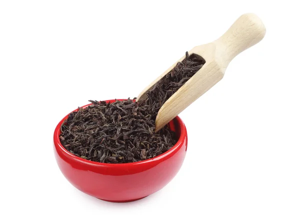 Dry black tea in a red bowl — Stock Photo, Image