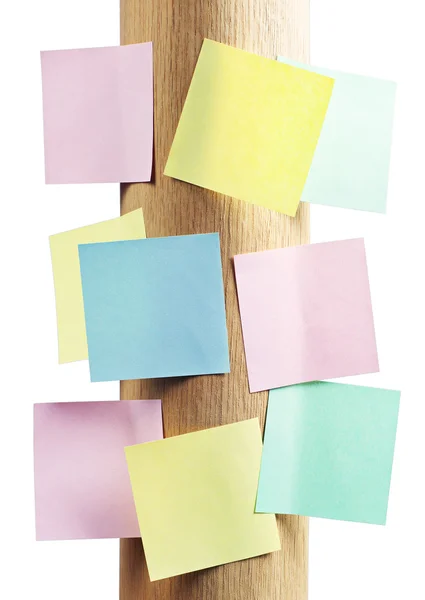 Note paper of different colors on a wooden stand — Stock Photo, Image