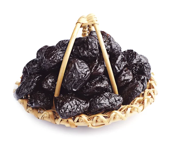 Dried plum in a wicker basket — Stock Photo, Image