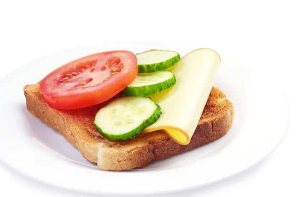 Toast with cheese, tomato and cucumber — Stock Photo, Image