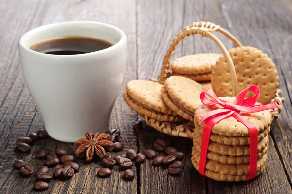 Sweet cookies tied ribbon and cup of coffee — Stock Photo, Image