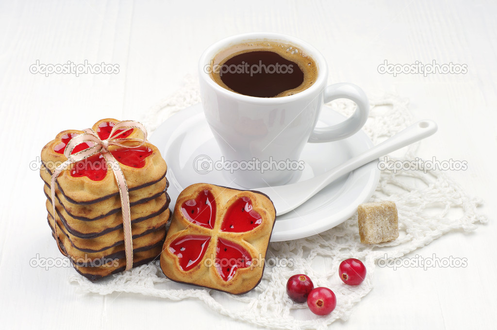 Cup of coffee and cookies tied ribbon