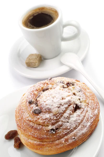 Round bun and cup of coffee — Stock Photo, Image