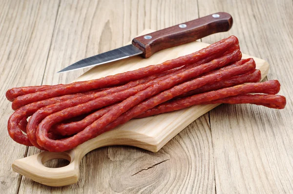 Lots of thin sausages — Stock Photo, Image