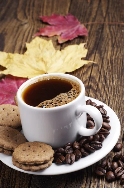 Cup of hot coffee and chocolate cookies Royalty Free Stock Photos